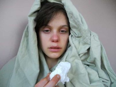 Person suffering from cold symptoms